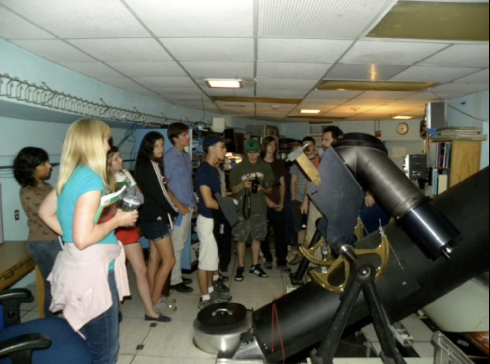 Students in a telescope control room.